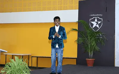 Jainam Jain speaking at a Motivational and visionary business session