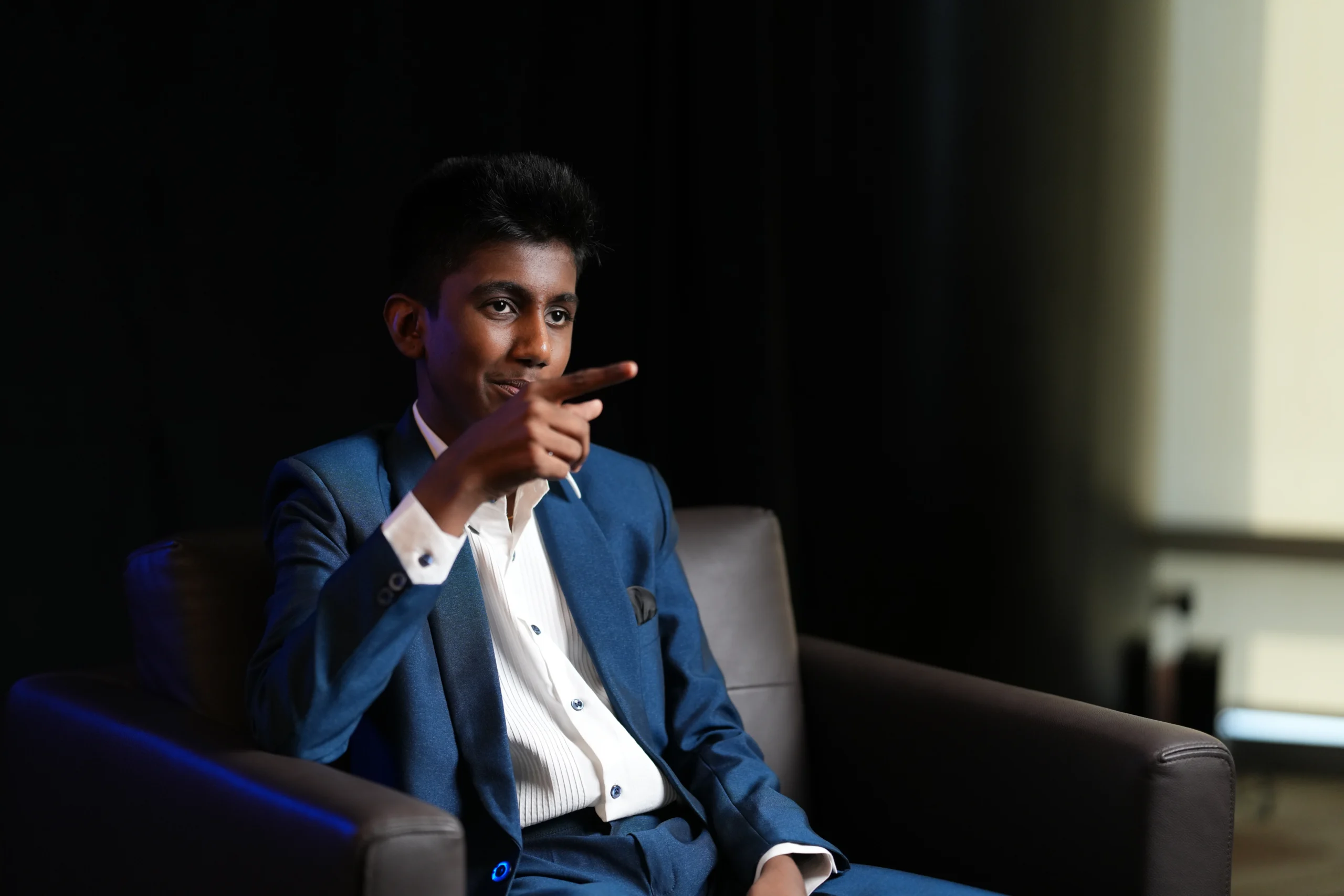 Jainam Jain speaking at a Motivational and visionary business session
